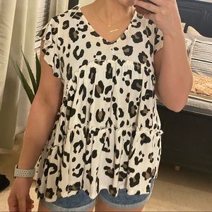 Leopard print short sleeve top.